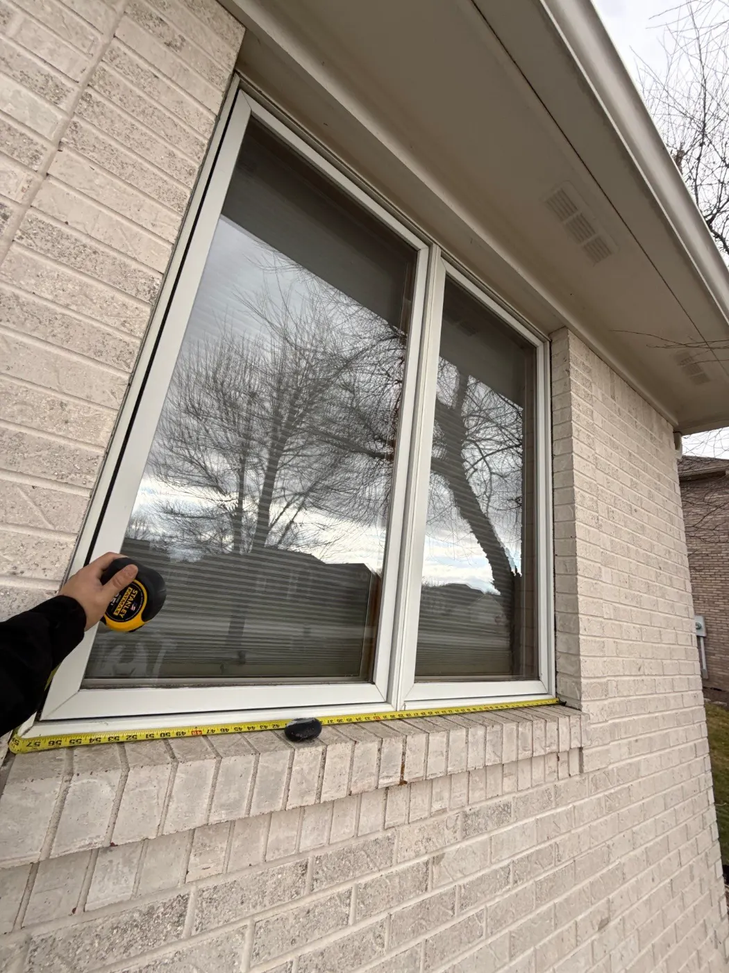 Frame and seal detail on a Hickory Ridge Village window job